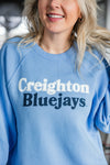Person wearing a blue 'Creighton Bluejays' sweatshirt