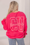 Person wearing a bright pink sweatshirt with 'CU Creighton' text, standing against a plain background.